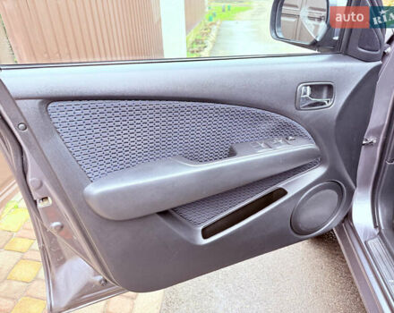 Серый Мицубиси Аутлендер, объемом двигателя 2.4 л и пробегом 240 тыс. км за 6900 $, фото 39 на Automoto.ua