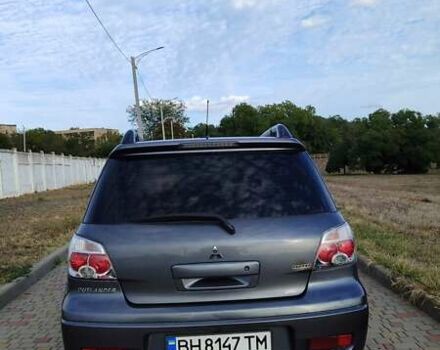 Серый Мицубиси Аутлендер, объемом двигателя 2.38 л и пробегом 189 тыс. км за 7600 $, фото 2 на Automoto.ua