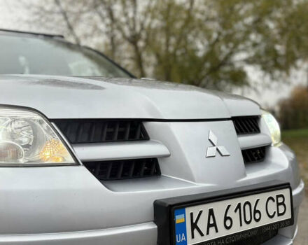 Серый Мицубиси Аутлендер, объемом двигателя 2.38 л и пробегом 238 тыс. км за 7450 $, фото 11 на Automoto.ua