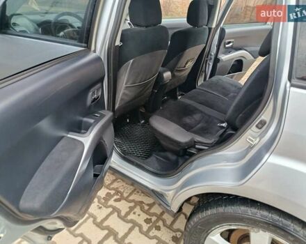 Серый Мицубиси Аутлендер, объемом двигателя 2 л и пробегом 332 тыс. км за 7650 $, фото 19 на Automoto.ua