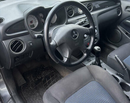 Серый Мицубиси Аутлендер, объемом двигателя 2 л и пробегом 200 тыс. км за 5900 $, фото 3 на Automoto.ua