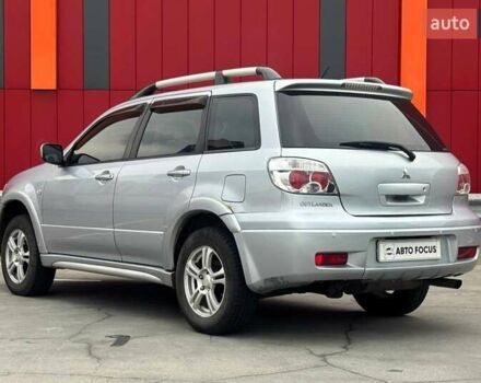 Серый Мицубиси Аутлендер, объемом двигателя 2.38 л и пробегом 245 тыс. км за 5390 $, фото 4 на Automoto.ua