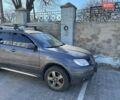 Серый Мицубиси Аутлендер, объемом двигателя 2 л и пробегом 202 тыс. км за 7500 $, фото 1 на Automoto.ua