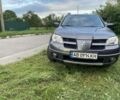 Сірий Міцубісі Аутлендер, об'ємом двигуна 2 л та пробігом 142 тис. км за 8600 $, фото 4 на Automoto.ua