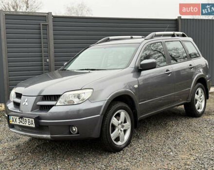 Серый Мицубиси Аутлендер, объемом двигателя 2.4 л и пробегом 240 тыс. км за 6900 $, фото 1 на Automoto.ua