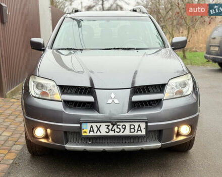 Серый Мицубиси Аутлендер, объемом двигателя 2.4 л и пробегом 240 тыс. км за 6900 $, фото 7 на Automoto.ua