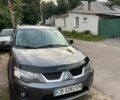 Серый Мицубиси Аутлендер, объемом двигателя 2 л и пробегом 220 тыс. км за 9100 $, фото 1 на Automoto.ua