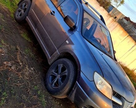 Сірий Міцубісі Аутлендер, об'ємом двигуна 2.4 л та пробігом 211 тис. км за 5000 $, фото 1 на Automoto.ua