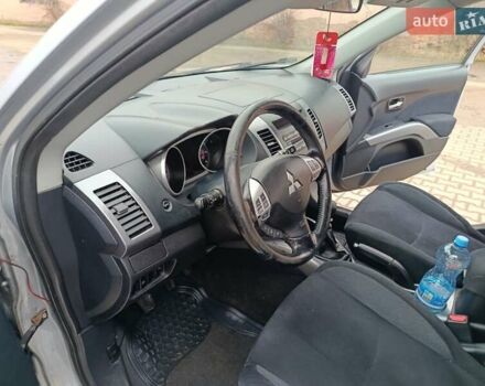 Серый Мицубиси Аутлендер, объемом двигателя 2 л и пробегом 332 тыс. км за 7650 $, фото 23 на Automoto.ua