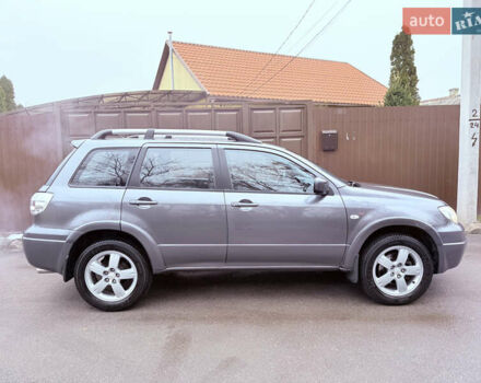 Серый Мицубиси Аутлендер, объемом двигателя 2.4 л и пробегом 240 тыс. км за 6900 $, фото 58 на Automoto.ua