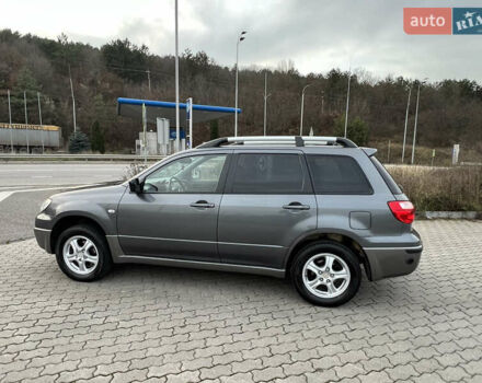 Серый Мицубиси Аутлендер, объемом двигателя 2 л и пробегом 196 тыс. км за 6450 $, фото 2 на Automoto.ua