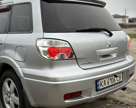 Серый Мицубиси Аутлендер, объемом двигателя 2.38 л и пробегом 238 тыс. км за 7450 $, фото 18 на Automoto.ua