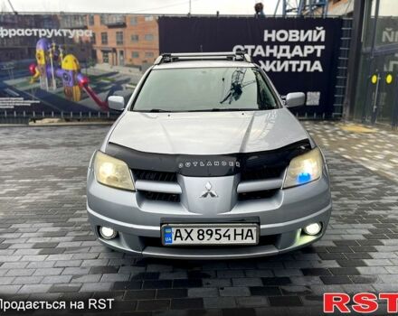 Серый Мицубиси Аутлендер, объемом двигателя 2.4 л и пробегом 280 тыс. км за 5800 $, фото 1 на Automoto.ua