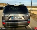Серый Мицубиси Аутлендер, объемом двигателя 2.4 л и пробегом 215 тыс. км за 7000 $, фото 5 на Automoto.ua
