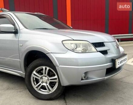 Сірий Міцубісі Аутлендер, об'ємом двигуна 2.38 л та пробігом 245 тис. км за 5990 $, фото 1 на Automoto.ua