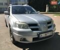 Серый Мицубиси Аутлендер, объемом двигателя 2.38 л и пробегом 182 тыс. км за 5850 $, фото 1 на Automoto.ua