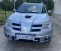 Сірий Міцубісі Аутлендер, об'ємом двигуна 2 л та пробігом 400 тис. км за 6200 $, фото 1 на Automoto.ua
