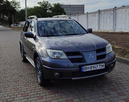 Серый Мицубиси Аутлендер, объемом двигателя 2.38 л и пробегом 189 тыс. км за 7600 $, фото 1 на Automoto.ua