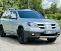 Сірий Міцубісі Аутлендер, об'ємом двигуна 2.4 л та пробігом 215 тис. км за 2900 $, фото 1 на Automoto.ua