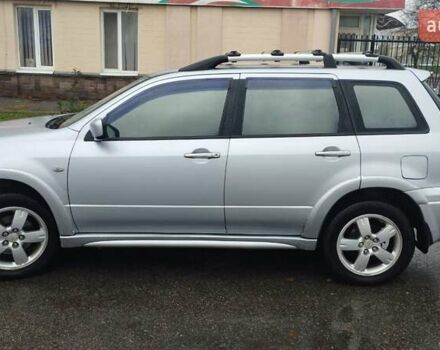 Серый Мицубиси Аутлендер, объемом двигателя 2.38 л и пробегом 204 тыс. км за 6100 $, фото 1 на Automoto.ua