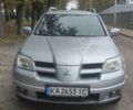 Серый Мицубиси Аутлендер, объемом двигателя 2.38 л и пробегом 200 тыс. км за 6500 $, фото 1 на Automoto.ua