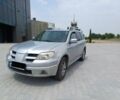 Серый Мицубиси Аутлендер, объемом двигателя 2.4 л и пробегом 243 тыс. км за 6200 $, фото 1 на Automoto.ua