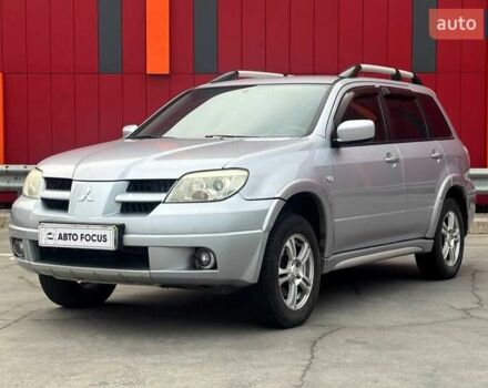 Серый Мицубиси Аутлендер, объемом двигателя 2.4 л и пробегом 245 тыс. км за 6790 $, фото 3 на Automoto.ua