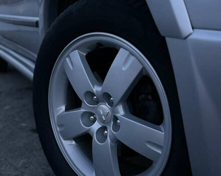 Серый Мицубиси Аутлендер, объемом двигателя 2.38 л и пробегом 238 тыс. км за 7450 $, фото 4 на Automoto.ua