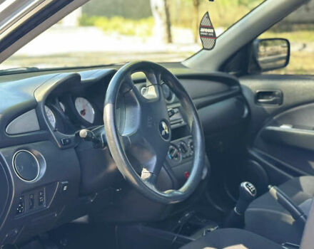 Серый Мицубиси Аутлендер, объемом двигателя 2 л и пробегом 270 тыс. км за 7999 $, фото 4 на Automoto.ua