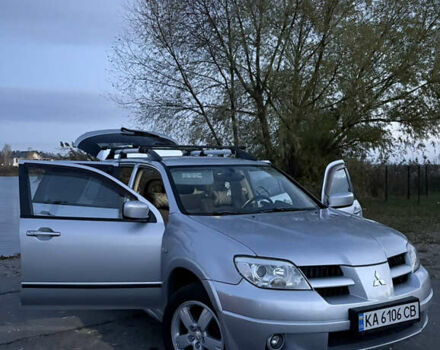 Серый Мицубиси Аутлендер, объемом двигателя 2.38 л и пробегом 238 тыс. км за 7450 $, фото 5 на Automoto.ua