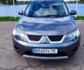 Серый Мицубиси Аутлендер, объемом двигателя 2 л и пробегом 322 тыс. км за 8800 $, фото 1 на Automoto.ua