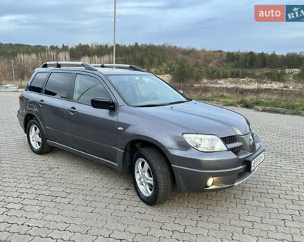 Серый Мицубиси Аутлендер, объемом двигателя 2 л и пробегом 196 тыс. км за 6450 $, фото 22 на Automoto.ua
