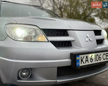 Серый Мицубиси Аутлендер, объемом двигателя 2.38 л и пробегом 238 тыс. км за 7450 $, фото 7 на Automoto.ua