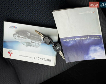 Серый Мицубиси Аутлендер, объемом двигателя 2.4 л и пробегом 240 тыс. км за 6900 $, фото 2 на Automoto.ua