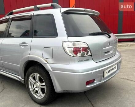 Серый Мицубиси Аутлендер, объемом двигателя 2.4 л и пробегом 245 тыс. км за 6790 $, фото 5 на Automoto.ua