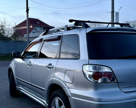 Серый Мицубиси Аутлендер, объемом двигателя 2.38 л и пробегом 238 тыс. км за 7450 $, фото 2 на Automoto.ua