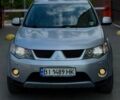 Серый Мицубиси Аутлендер, объемом двигателя 2.36 л и пробегом 335 тыс. км за 9000 $, фото 2 на Automoto.ua
