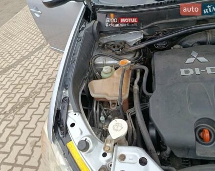 Серый Мицубиси Аутлендер, объемом двигателя 2 л и пробегом 332 тыс. км за 7650 $, фото 28 на Automoto.ua