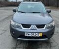 Серый Мицубиси Аутлендер, объемом двигателя 2 л и пробегом 258 тыс. км за 5000 $, фото 1 на Automoto.ua