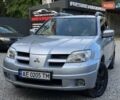 Серый Мицубиси Аутлендер, объемом двигателя 2.38 л и пробегом 299 тыс. км за 7300 $, фото 1 на Automoto.ua