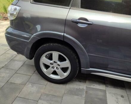 Серый Мицубиси Аутлендер, объемом двигателя 2.4 л и пробегом 23 тыс. км за 8300 $, фото 1 на Automoto.ua