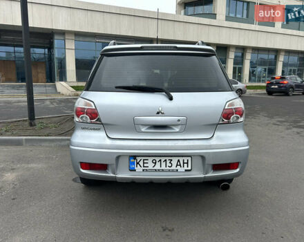 Серый Мицубиси Аутлендер, объемом двигателя 2.38 л и пробегом 81 тыс. км за 8700 $, фото 4 на Automoto.ua