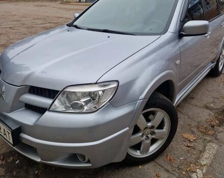 Серый Мицубиси Аутлендер, объемом двигателя 2.38 л и пробегом 113 тыс. км за 8900 $, фото 5 на Automoto.ua