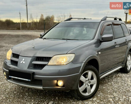 Серый Мицубиси Аутлендер, объемом двигателя 2 л и пробегом 199 тыс. км за 5999 $, фото 4 на Automoto.ua
