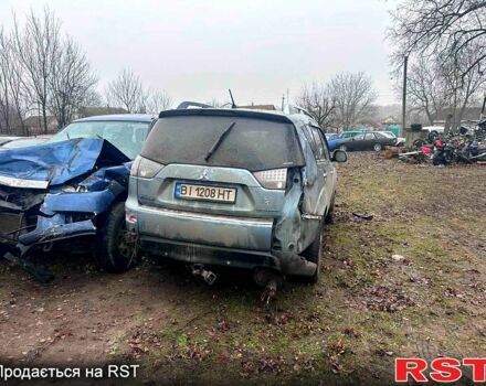 Серый Мицубиси Аутлендер, объемом двигателя 2.4 л и пробегом 205 тыс. км за 3500 $, фото 1 на Automoto.ua
