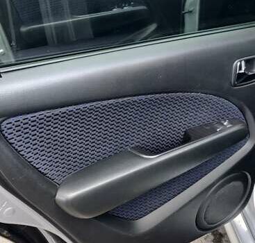 Серый Мицубиси Аутлендер, объемом двигателя 2.38 л и пробегом 323 тыс. км за 6800 $, фото 5 на Automoto.ua