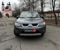 Серый Мицубиси Аутлендер, объемом двигателя 2.4 л и пробегом 237 тыс. км за 8490 $, фото 1 на Automoto.ua