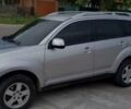 Сірий Міцубісі Аутлендер, об'ємом двигуна 2.4 л та пробігом 245 тис. км за 9000 $, фото 1 на Automoto.ua