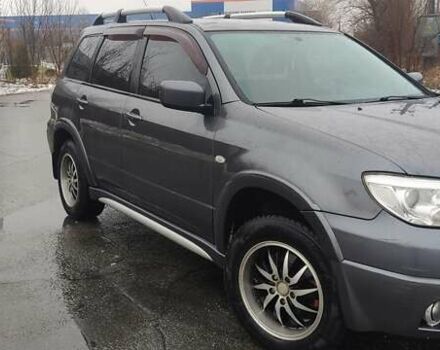 Серый Мицубиси Аутлендер, объемом двигателя 2 л и пробегом 200 тыс. км за 5999 $, фото 7 на Automoto.ua