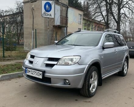 Серый Мицубиси Аутлендер, объемом двигателя 2 л и пробегом 247 тыс. км за 5999 $, фото 4 на Automoto.ua